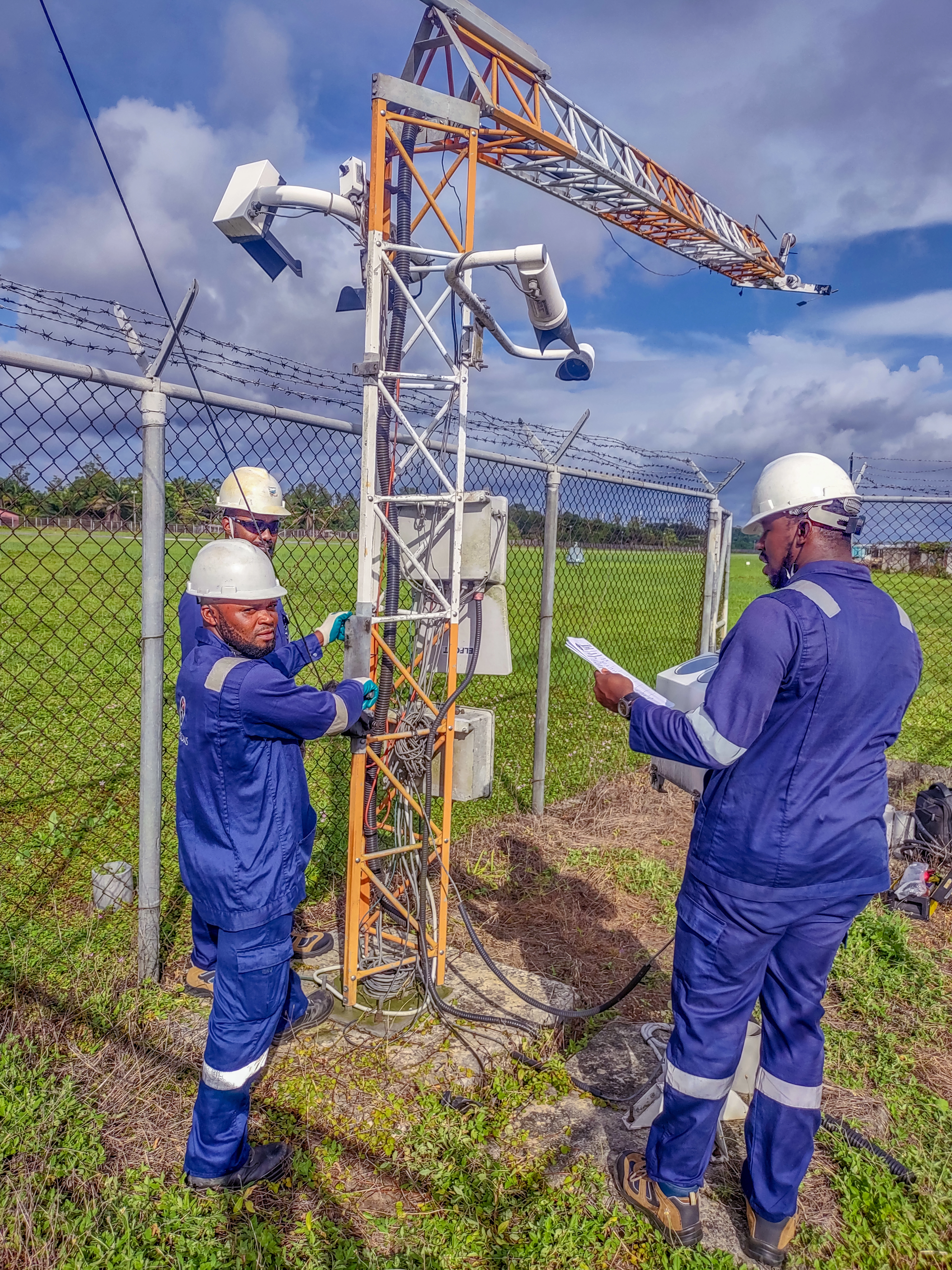Ping Telecoms staff working on AWOS device at Escravos